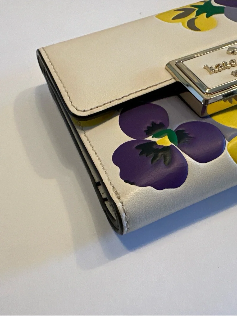 Kate Spade New York Reegan Pansy cream wallet with purple and yellow floral